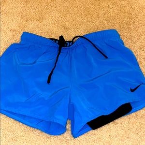 Blue Nike running shorts